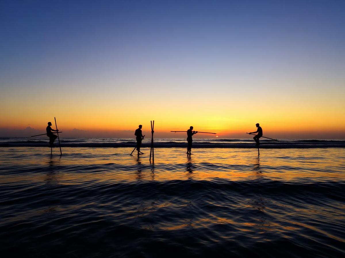 Stilt Fishermen at Sunrise